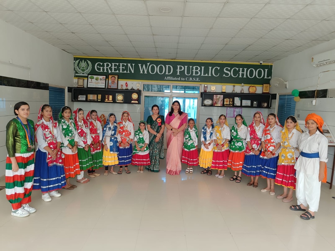 Greenwood Public School students in traditional Haryanvi folk dance costume with their teachers